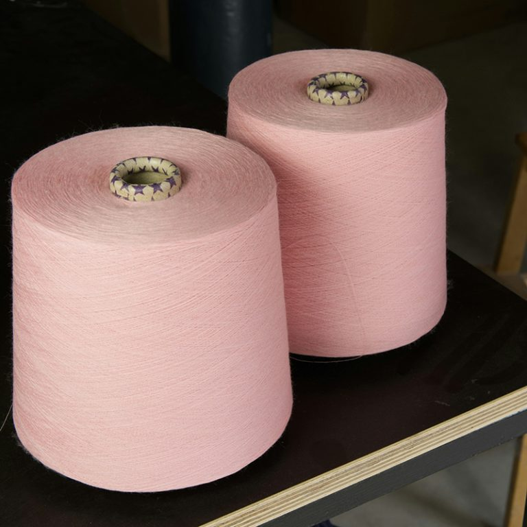 White open-end yarn cones